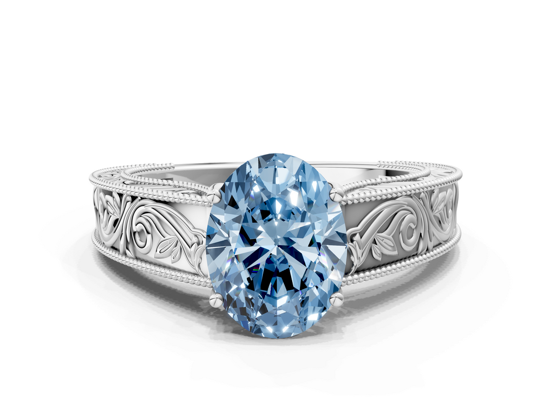White gold Fancy Blue Oval  Cut Solitaire Engraved Band with Four-Prong Setting_62