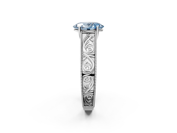 Platinum Fancy Blue Oval Cut Diamond Solitaire Ring with Engraved Band and Four-Prong Setting