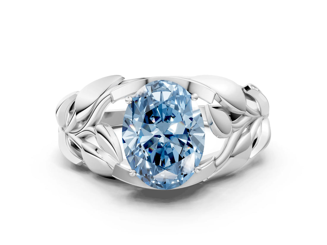 White gold Fancy Blue Oval Cut Solitaire Leaf-Inspired Engagement Ring with Prong Setting