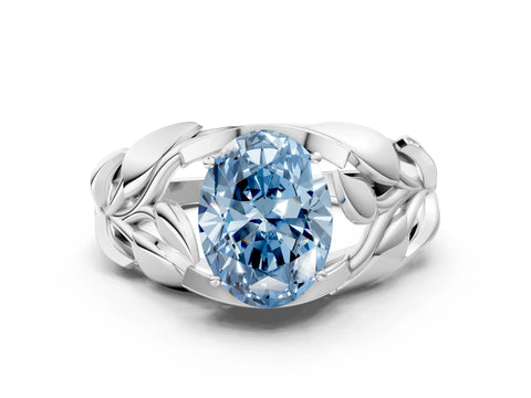 White gold Fancy Blue Oval Cut Solitaire Leaf-Inspired Engagement Ring with Prong Setting