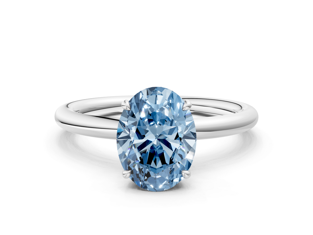 White gold Fancy Blue Oval  Cut Solitaire Ring with Thin Band and Four-Prong Setting_16
