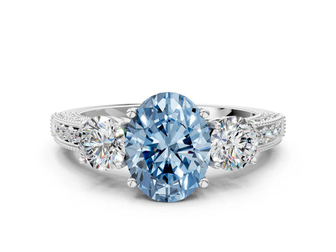White gold Fancy Blue Oval Cut Three-Stone Diamond Ring with Pavé Band and Four-Prong Setting
