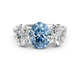 White gold Fancy Blue Oval Cut Three-Stone Diamond Ring with Prong Setting on a Classic Band_12