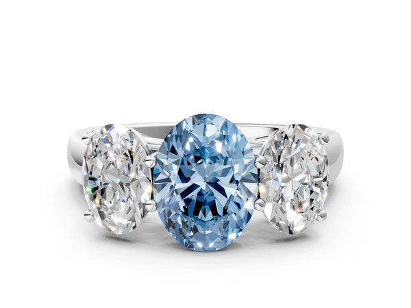 White gold Fancy Blue Oval Cut Three-Stone Diamond Ring with Prong Setting on a Classic Band
