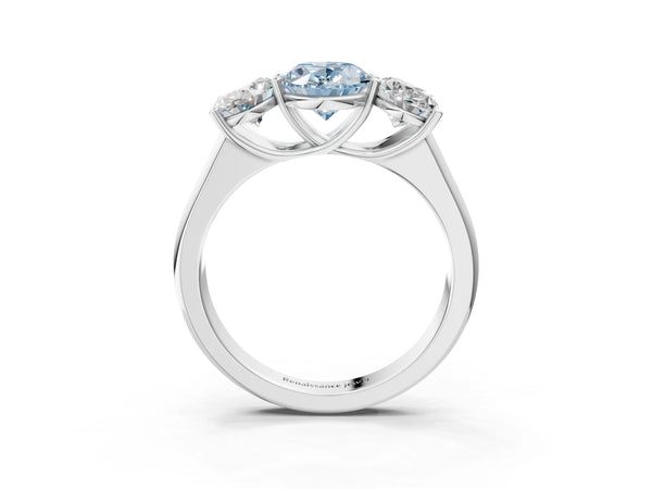 White gold Fancy Blue Oval Cut Three-Stone Diamond Ring with Prong Setting on a Classic Band
