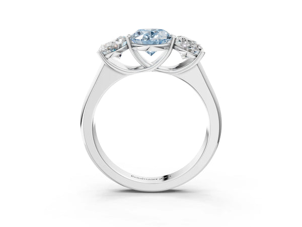 White gold Fancy Blue Oval Cut Three-Stone Diamond Ring with Prong Setting on a Classic Band