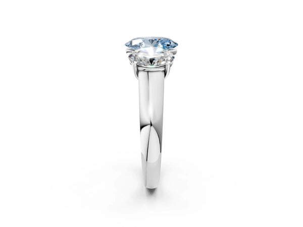 White gold Fancy Blue Oval Cut Three-Stone Diamond Ring with Prong Setting on a Classic Band