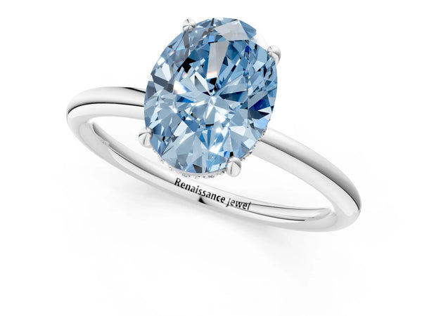 White gold Fancy Blue Oval  Solitaire Diamond Ring with a Classic Band and Four-Prong Setting