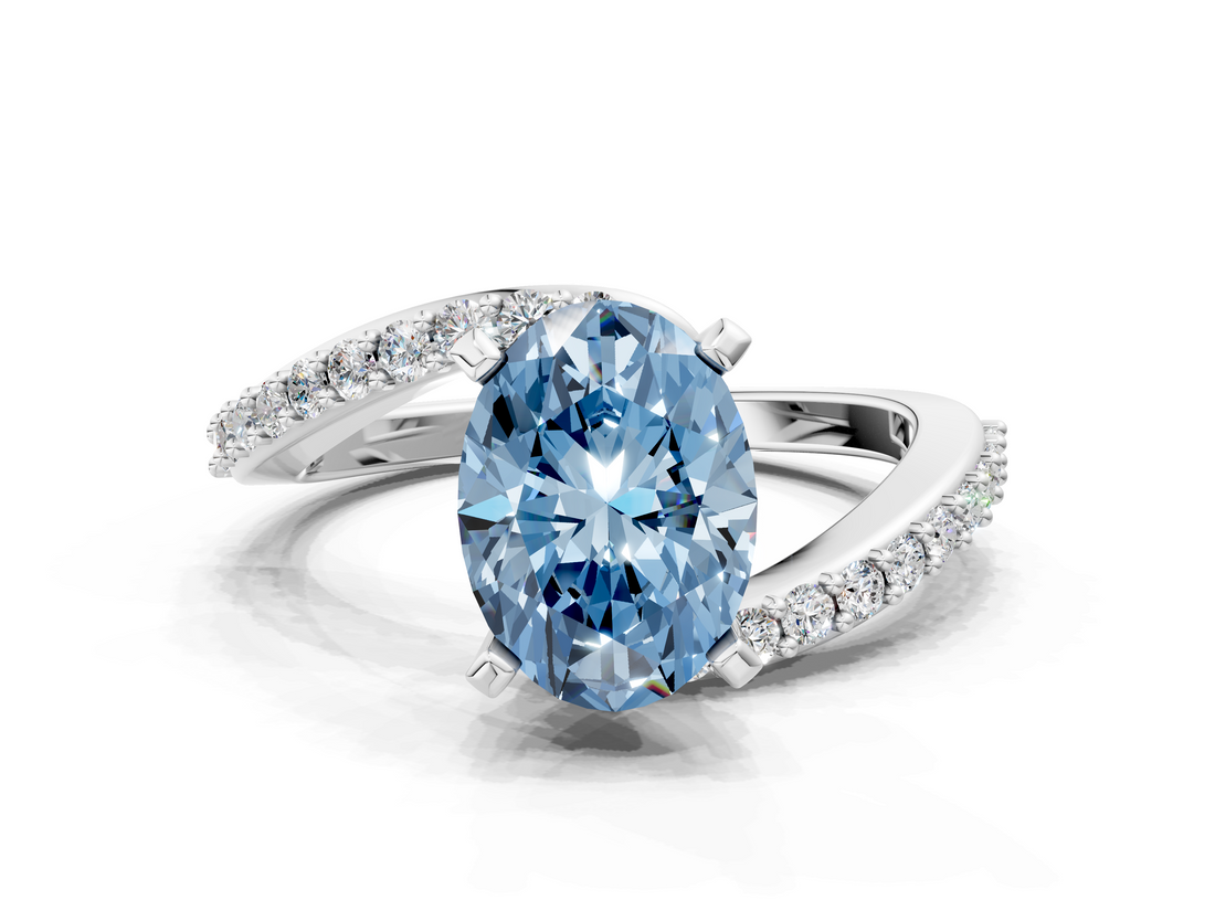 White gold Fancy Blue Oval  Solitaire Twist Band with Pave Set Diamonds and Four-Prong Setting_147