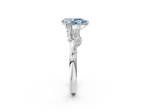 Platinum Fancy Blue Pear Cut Diamond Solitaire Ring with Leaf Motif Band and Four-Prong Setting