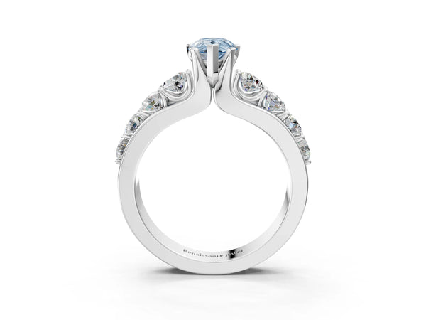 White gold Fancy Blue Pear  Brilliant Solitaire with Side Stones on a Pave Band and Four-Prong Setting