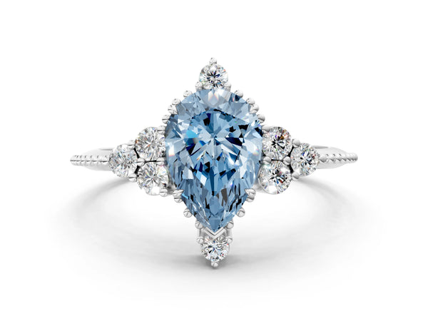 Platinum Fancy Blue Pear Cut Brilliant Diamond with Cluster Setting on a Beaded Band and Four-Prong Setting