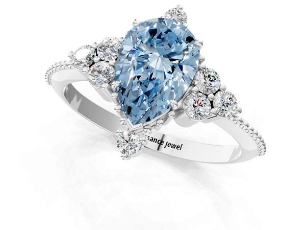 Platinum Fancy Blue Pear Cut Brilliant Diamond with Cluster Setting on a Beaded Band and Four-Prong Setting