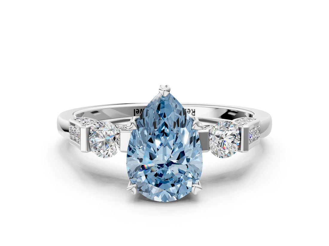 White gold Fancy Blue Pear Cut Brilliant Three-Stone Pave Band with Four-Prong Setting