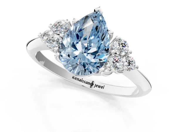 Platinum Fancy Blue Pear Cut Cut Diamond Cluster Ring with Solitaire Band and Four-Prong Setting