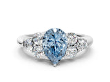 White gold Fancy Blue Pear  Cut Diamond Cluster Ring with Round Accent Stones and Prong Setting on a Classic Band_78