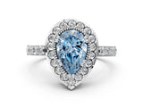White gold Fancy Blue Pear Cut Diamond Halo Ring with Pavé Band and Prong Setting