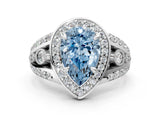 White gold Fancy Blue Pear Cut Diamond Halo Ring with Split Shank and Bezel Accents and Four-Prong Setting