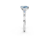 White gold Fancy Blue Pear  Cut Diamond Ring with Baguette Side Stones, Channel Set Band, and Four-Prong Setting_38