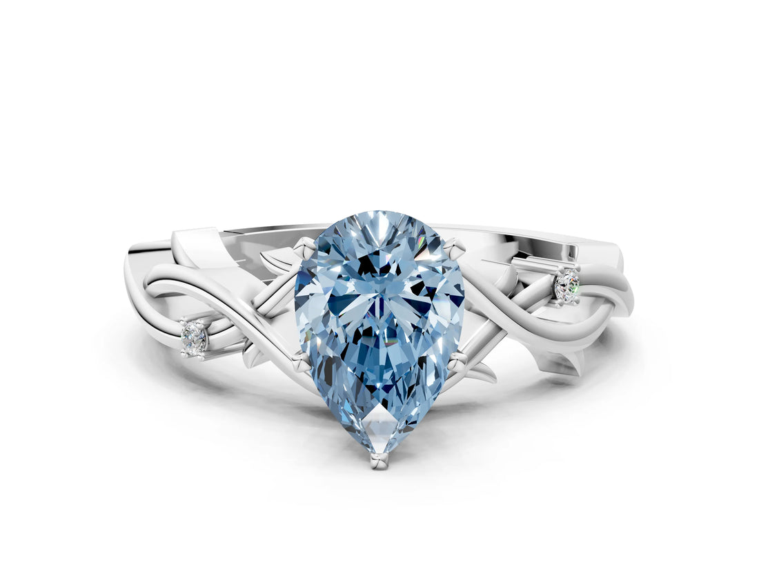 White gold Fancy Blue Pear Cut Diamond Solitaire Ring with Twisted Band and Prong Setting_306