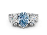 White gold Fancy Blue Pear Cut Diamond Three-Stone Ring with Channel Set Band and Four-Prong Setting_60