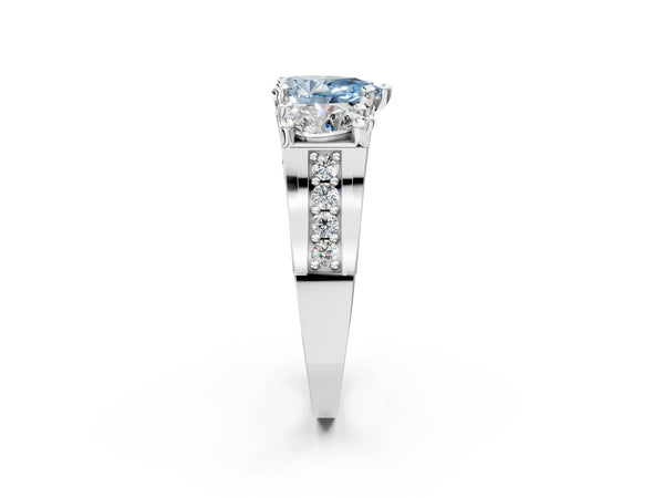White gold Fancy Blue Pear Cut Diamond Three-Stone Ring with Channel Set Band and Four-Prong Setting