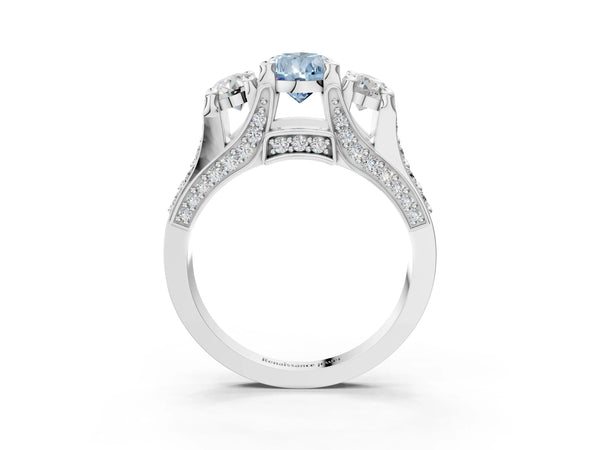White gold Fancy Blue Pear Cut Diamond Three-Stone Ring with Channel Set Band and Four-Prong Setting