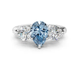 White gold Fancy Blue Pear Cut Diamond Three-Stone Ring with Prong Setting and Pavé Band