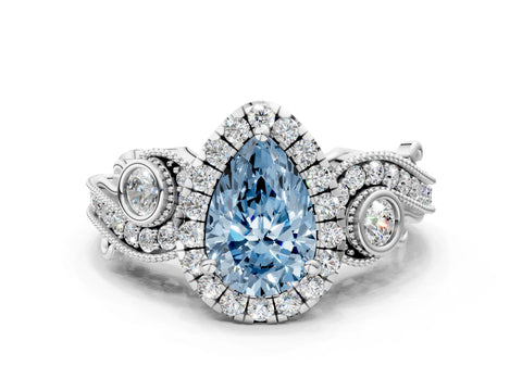 White gold Fancy Blue Pear Cut Halo Diamond Ring with Milgrain and Bezel Accents on a Split Shank Band