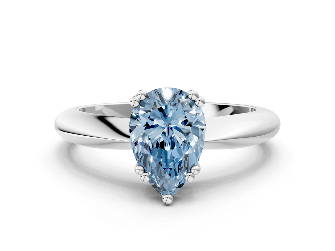 White gold Fancy Blue Pear  Cut Solitaire Engagement Ring with Tapered Band and Four-Prong Setting