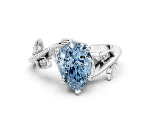 White gold Fancy Blue Pear Cut Solitaire Twist Engagement Ring with Leaf Accents and Prong Setting_12