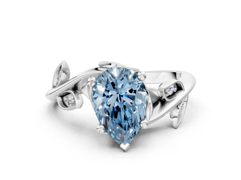 White gold Fancy Blue Pear Cut Solitaire Twist Engagement Ring with Leaf Accents and Prong Setting_12