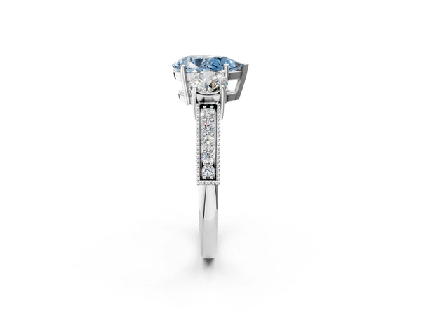Platinum Fancy Blue Pear Cut Three-Stone Diamond Ring with Pavé Band and Four-Prong Setting