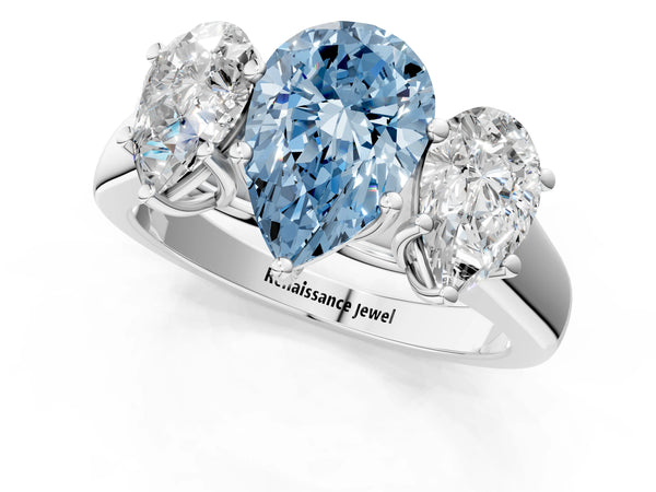 White gold Fancy Blue Pear Cut Three-Stone Diamond Ring with Prong Setting on a Classic Band