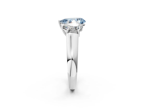 White gold Fancy Blue Pear Cut Three-Stone Diamond Ring with Prong Setting on a Classic Band