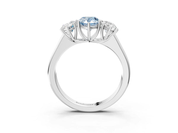 White gold Fancy Blue Pear Cut Three-Stone Diamond Ring with Prong Setting on a Classic Band