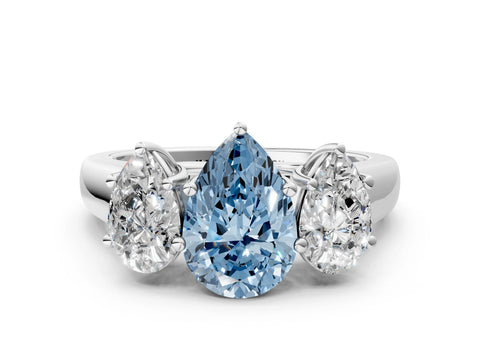 White gold Fancy Blue Pear Cut Three-Stone Diamond Ring with Prong Setting on a Classic Band