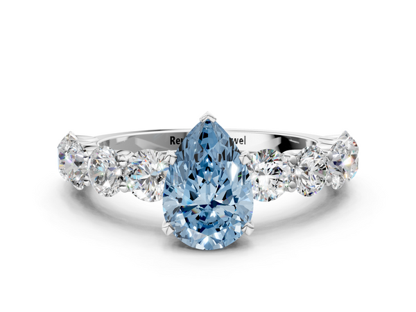 White gold Fancy Blue Pear Cut Diamond Prong Setting with Side Stones on a Pave Band