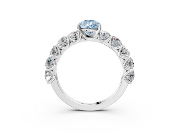 White gold Fancy Blue Pear Cut Diamond Prong Setting with Side Stones on a Pave Band