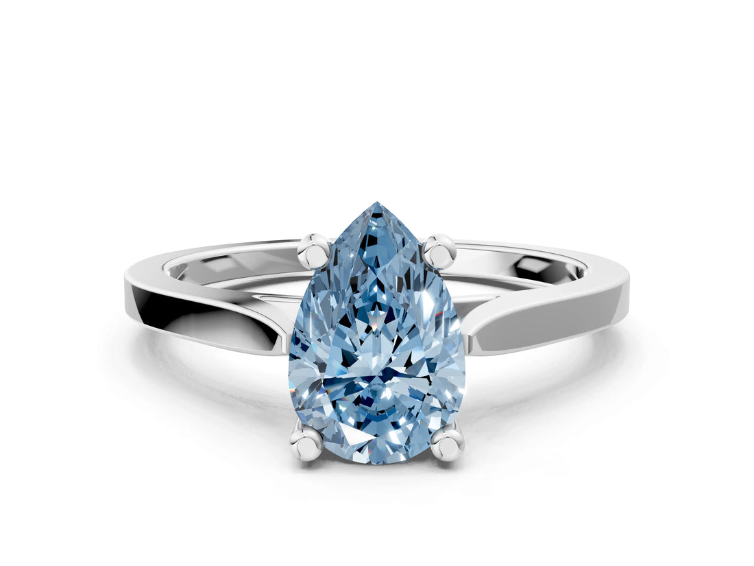White gold Fancy Blue Pear  Solitaire Diamond Ring with Four-Prong Setting and Tapered Band 1