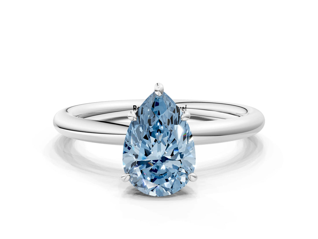White gold Fancy Blue Pear  Solitaire Diamond Ring with Four-Prong Setting on a Plain Band_32