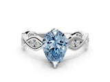 White gold Fancy Blue Pear  Solitaire Twist Band with Leaf Prong Setting