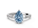 White gold Fancy Blue Pear  Solitaire with Side Baguettes and Channel Set Band_79