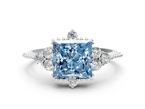 White gold Fancy Blue Princess Cut Brilliant Diamond with Cluster Setting on a Beaded Band and Four-Prong Setting