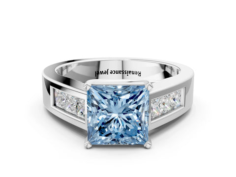 White gold Fancy Blue Princess Cut Cut Channel Set Solitaire Ring with Four-Prong Setting