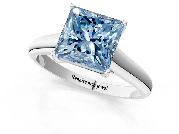 White gold Fancy Blue Princess Cut Cut Diamond Solitaire Engagement Ring with Tapered Plain Band and Four-Prong Setting
