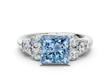 White gold Fancy Blue Princess  Cut Diamond Cluster Ring with Round Accent Stones and Prong Setting on a Classic Band_49
