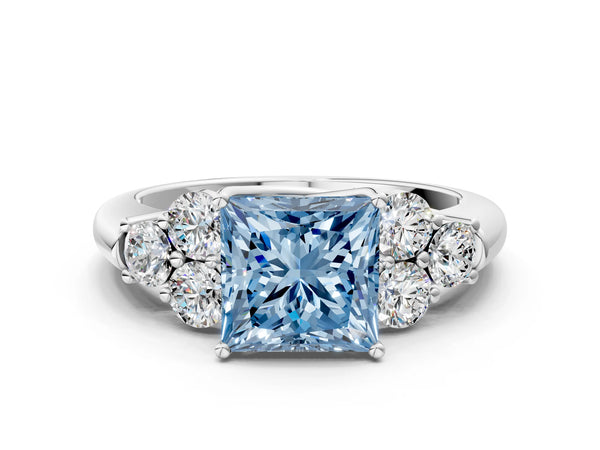 White gold Fancy Blue Princess  Cut Diamond Cluster Ring with Round Accent Stones and Prong Setting on a Classic Band