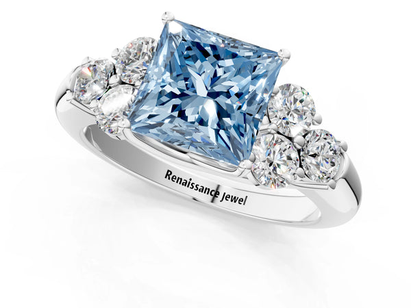 White gold Fancy Blue Princess  Cut Diamond Cluster Ring with Round Accent Stones and Prong Setting on a Classic Band