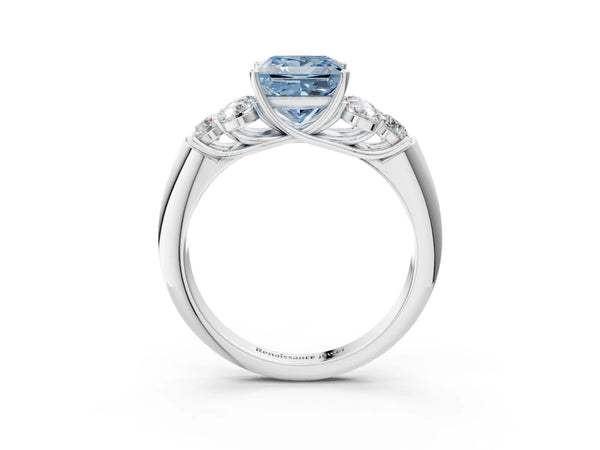 White gold Fancy Blue Princess  Cut Diamond Cluster Ring with Round Accent Stones and Prong Setting on a Classic Band